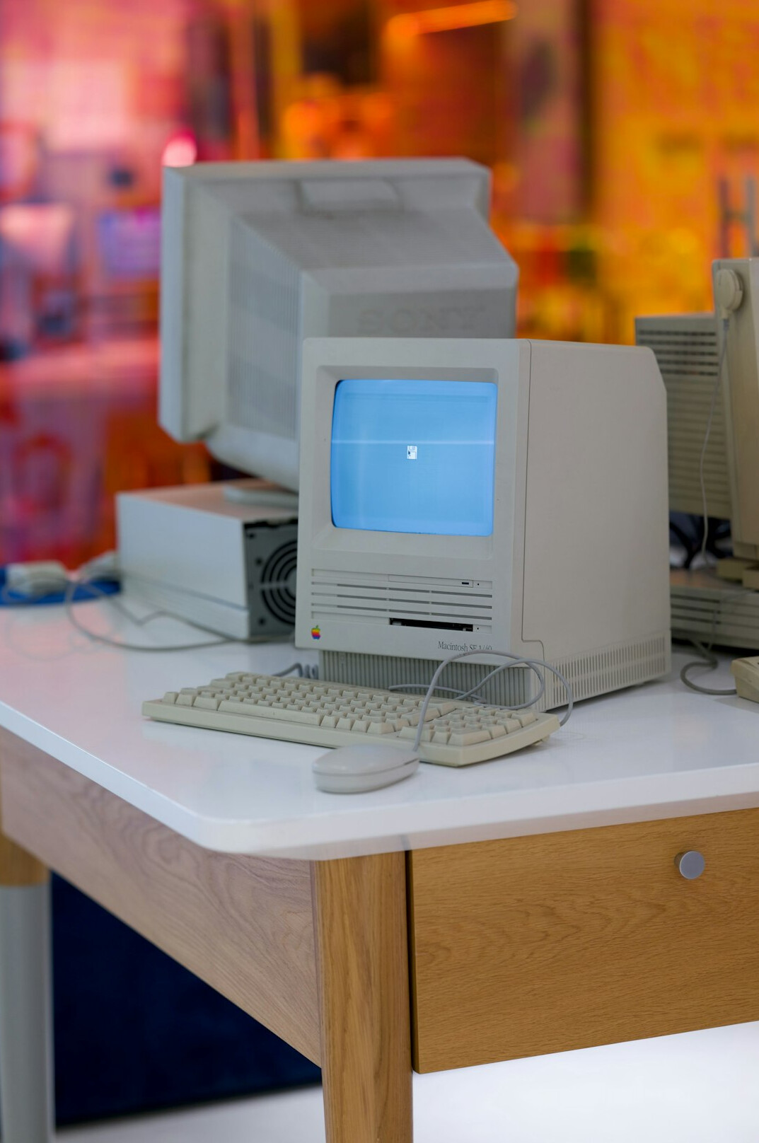 Vintage graphic design studio desk with storyboards and an old computer